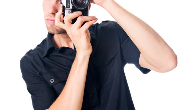 Young man with camera